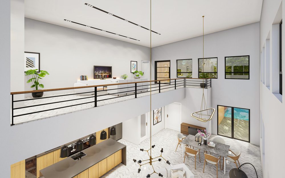 Bright double-height room with a loft level behind a black metal railing above a living and dining area