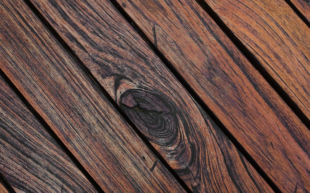 Close-up of warm brown wood deck boards running on a diagonal