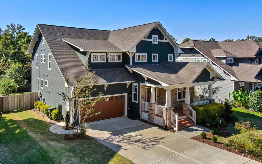 Two-story craftsman house with living space and windows above the attached garage