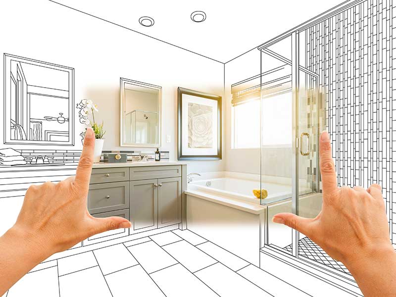 A hand points at a sketched bathroom, illustrating its layout and features for design reference.